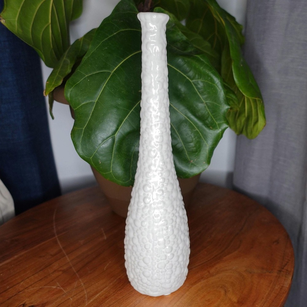 White vase with long neck and gourd like ribbed textured